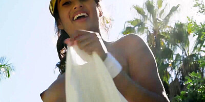 Hot Latina babe gets naked on a tennis court and shows her natural tits