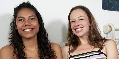 Tanned curly babe gets her pussy fingered by white brunette