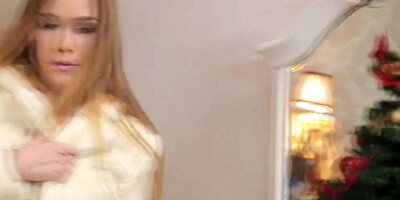 Alexis Crystal is spanked and fucked next to a Christmas tree