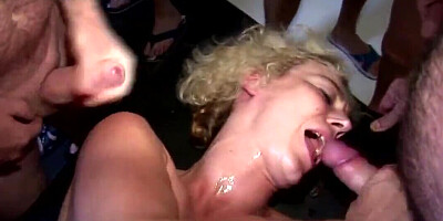 Filthy whore gets facialized by a crowd of fuckers