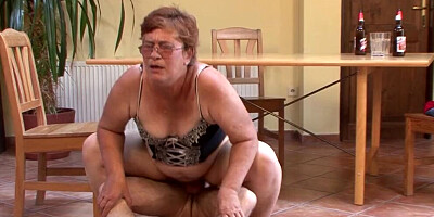 Short-haired mature woman gets fucked on the table and floor