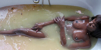 Tall black girl Ana Foxxx is filmed while getting naked and taking a bath