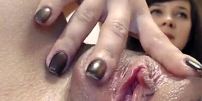 Adorable woman is giving a close-up on her wet cunny after passionate rubbing