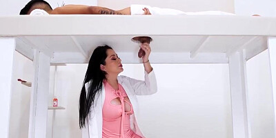 Lustful brunette strokes a dick through a milking table before fucking