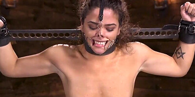 Tied up slavegirl is tortured by a kinky master in BDSM dungeon