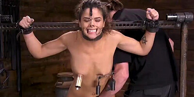 Tied up slavegirl is tortured by a kinky master in BDSM dungeon