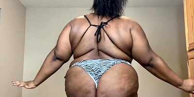 Curvy black woman gets naked and plays with a sex toy