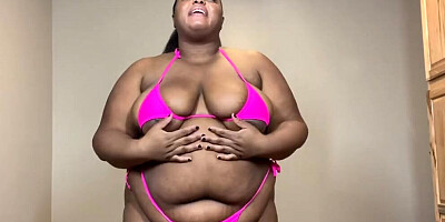 Curvy black woman gets naked and plays with a sex toy