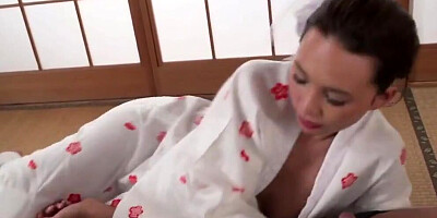 Asian cougar is rubbed with oil and fucked on the floor