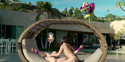 Two beautiful babes enjoy lesbian sex in the sun