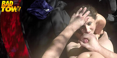 A bimbo is in the car, pulling and sucking a hard cock outdoors