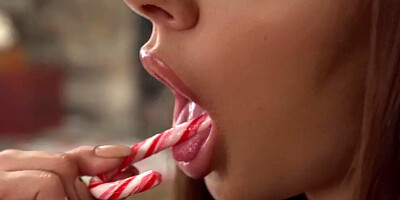 Two petite girls are having steamy FFM threesome by the Christmas tree