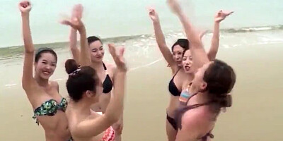Naughty Asian babes are dancing fully naked on the beach