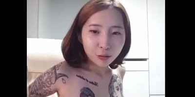 Petite Asian chick is playing with her nice tits on webcam