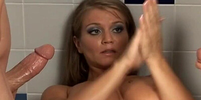 Busty cougar gives nice handjobs to these two well-hung fellows