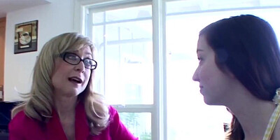 Nina Hartley and Ally Evans are making out on the couch