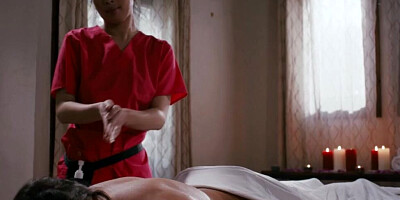 Asian masseuse and her white client have lesbian sex after a gentle body rubbing