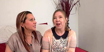 MILF and her stepdaughter are kissing and making out in the bedroom
