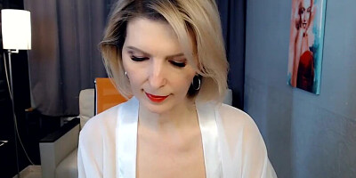 Naughty cougar poses in sexy stockings and teases her fans