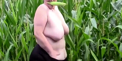 Fat mature woman gets naked and masturbates in the corn field