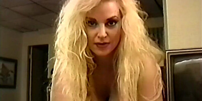 Busty MILF Chessie Moore squeezes her humongous tits in a solo video