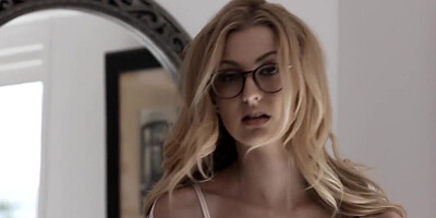 Blonde minx with glasses behaves very naughtily in the bedroom