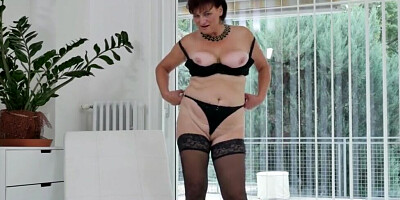 Curvy mature lady gets naked and masturbates in front of the camera