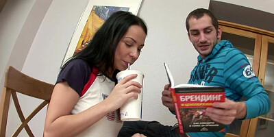 A black haired bimbo is sitting on a large erect penis for anal