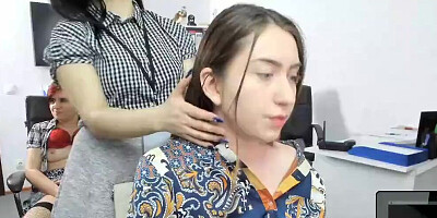 Lesbian girl enjoys while girlfriend massages her neck and shoulders