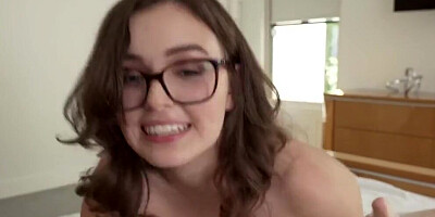 Nerdy girl smiles at the camera while riding that hard cock