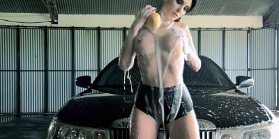 Enjoy a smoking hot busty babe who is washing a car topless