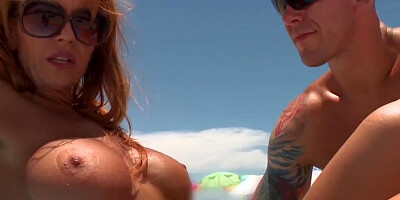 Busty redhead Janet Mason fucks a guy she just meet on the beach