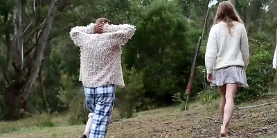 A couple of natural girls are practicing naked yoga and meditation outdoors