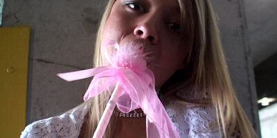 Blonde girl is stripping and masturbating at the public place