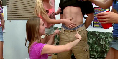 A couple of kinky girls are taking turns on one stiff dong