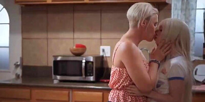 Short-haired cougar has passionate lesbo lovemaking with her stepdaughter in the kitchen