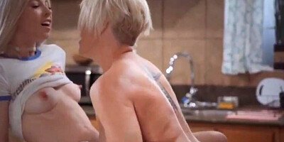 Short-haired cougar has passionate lesbo lovemaking with her stepdaughter in the kitchen