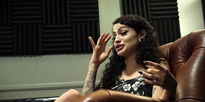 Curly-haired brunette harlot with tattoos participates in a gangbang