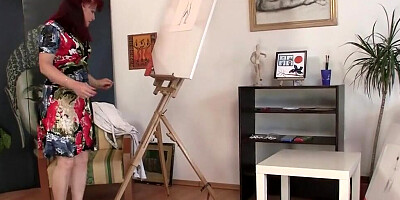 Mature painter fucks with a handsome model in the studio