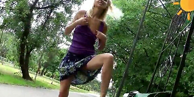 Dude is filming his girlfriend masturbating her bald cunny in a public park