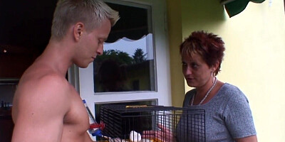 Redheaded granny is devouring a young stiff penis