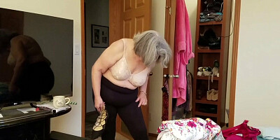 Naughty chubby grandma tries some clothes in front of the webcam