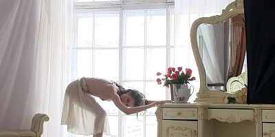 Petite chick strips and poses in this erotic photo session