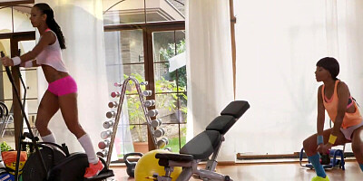 Black hotties are having girl on girl action on the gym floor