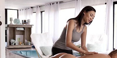 A blonde and a brunette massaging and scissoring