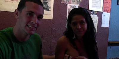 Gorgeous Latina having fun and interacting with men in the pub