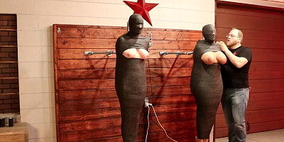 Two helpless girls are tightly wrapped and left to struggle