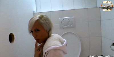 Man behind the wall has sex with girl in the loo
