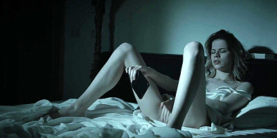 Cute girl studies her pussy in the mirror as she masturbates