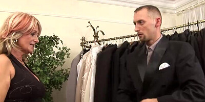 Horny tailor fucks a lovely blonde mature lady in his shop